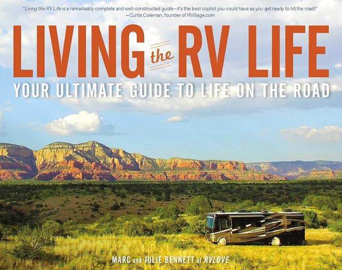 Cover of best-selling book Living the RV Life featuring a luxury RV amid a uniquely lush desert background.