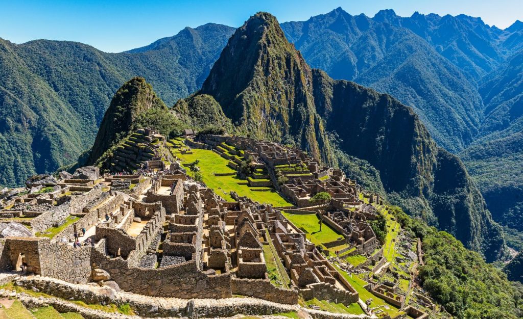 The Inca Trail in Peru leads to the Sun Gate at Machu Picchu amid the ancient ruins, one of the best hiking trails in the world.