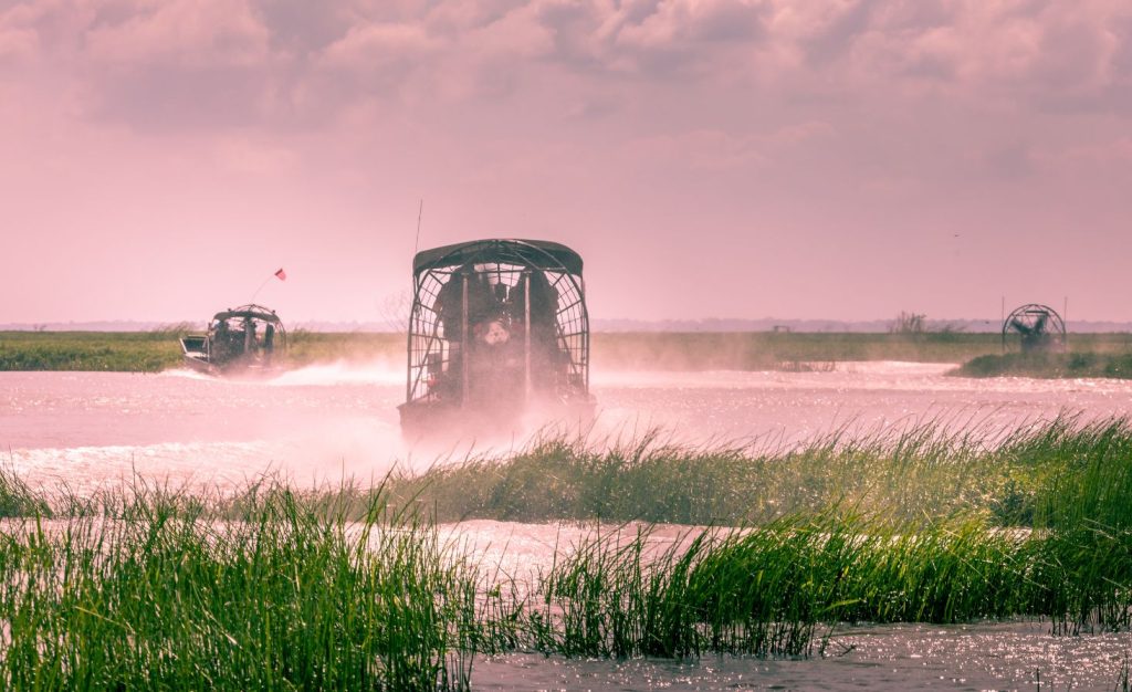 Photo of airboats exploring the Florida Everglades where wildlife and great fishing abounds. A top warm winter camping destination.